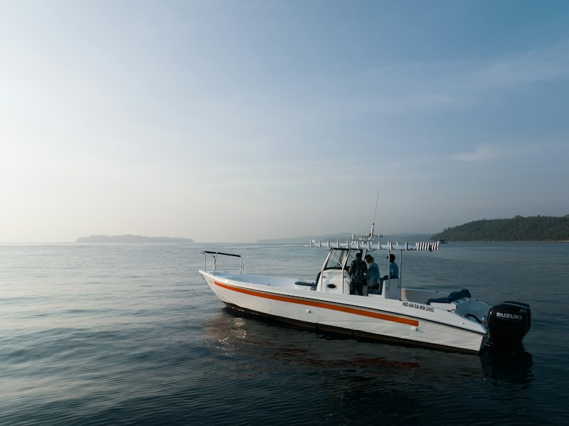 Center-console boat with a T-top on calm water