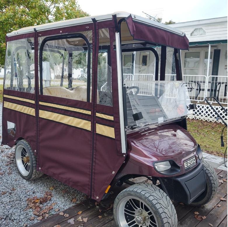 Maroon golf cart enclosure made by A&J Canvas